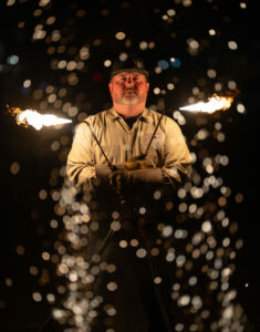 Dorman Vick, featured in the May issue of The Kendall Gentleman, stands with welding torches ablaze, representing the revival of vocational education in Texas.