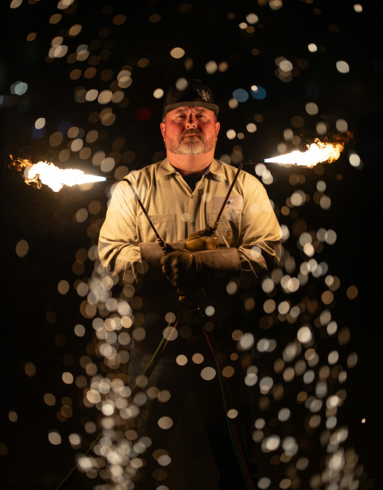 Dorman Vick, Featured in the May Issue of the Kendall Gentleman, Stands with Welding Torches Ablaze, Representing the Revival of Vocational Education in Texas.
