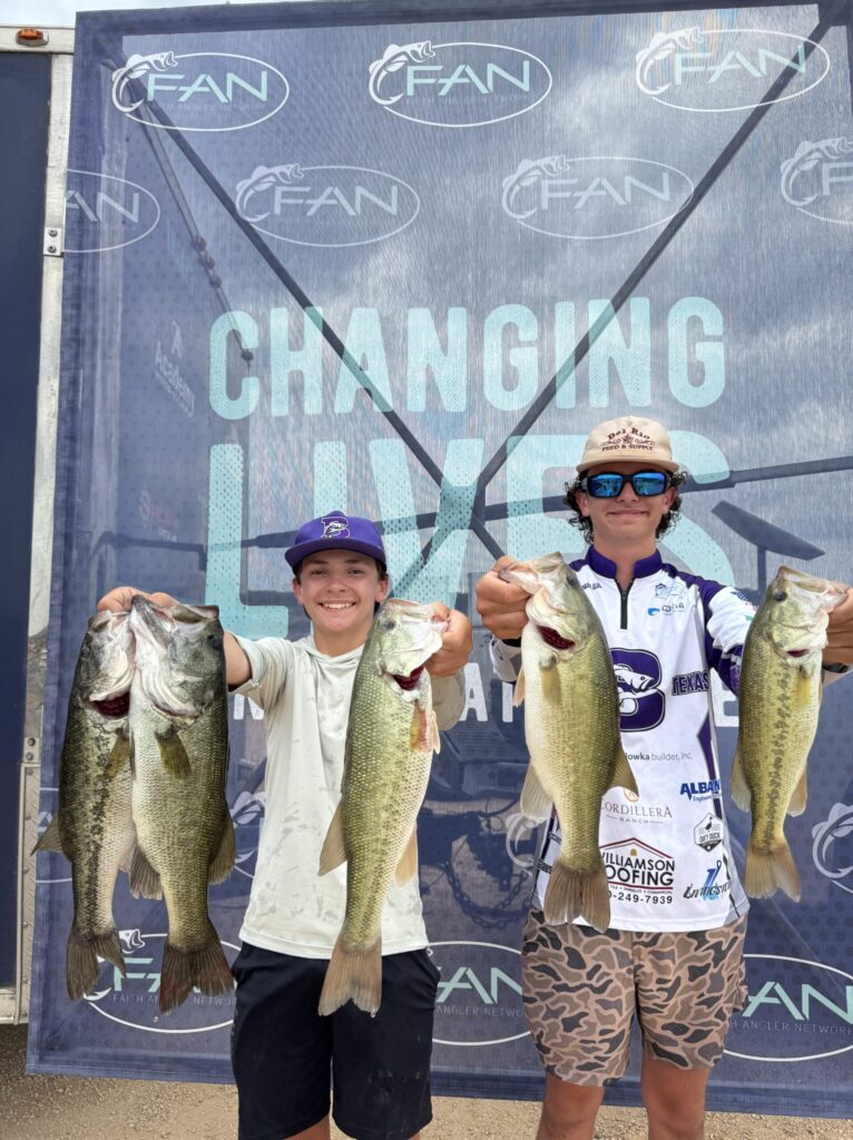 Boerne Bass Club Teens Show off Their Bass at Fan Tournament - the Kendall Gentleman Two Young Anglers from the Boerne Bass Club Proudly Hold Up Their Bass Catches at a Faith Angler Network Competition.