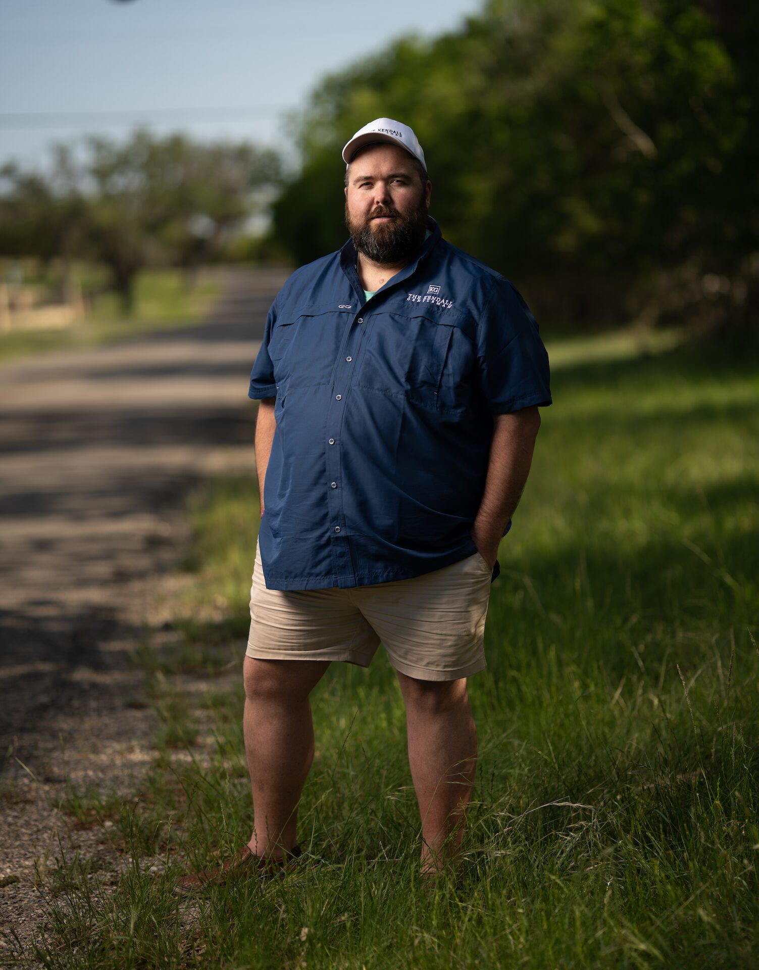 Michael Ethridge Stands Along a Quiet Country Road in Kendall County, Texas, Reflecting on the Values of Grit, Grace, and Gentlemanly Character.