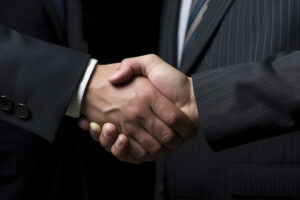 Two men in suits shaking hands, symbolizing integrity, trust, and the strength of keeping one’s word.