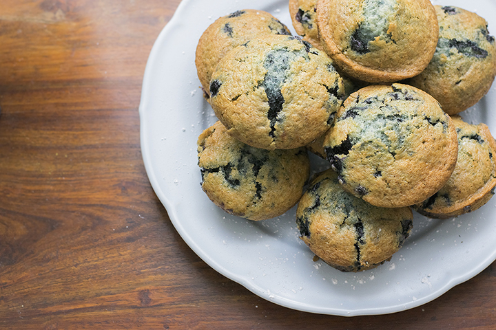 a Warm Muffin on a Plate Beside a Cup of Coffee, Representing Coach Stan Leech’s Story “find the Butavan” About Faith, Humor, and Life’s Small Blessings.
