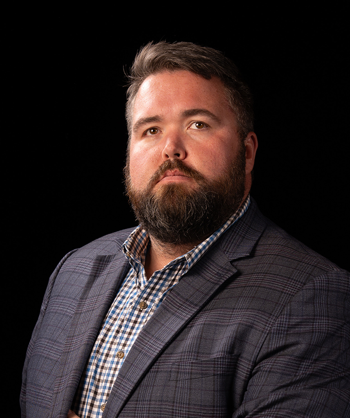 Michael G. Ethridge, Publisher of the Kendall Gentleman, Photographed Against a Black Background for His December 2025 Editorial, “the Standard We Keep.”
