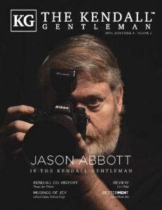 April 2026 cover of The Kendall Gentleman magazine featuring photographer Jason Abbott holding a Nikon camera.