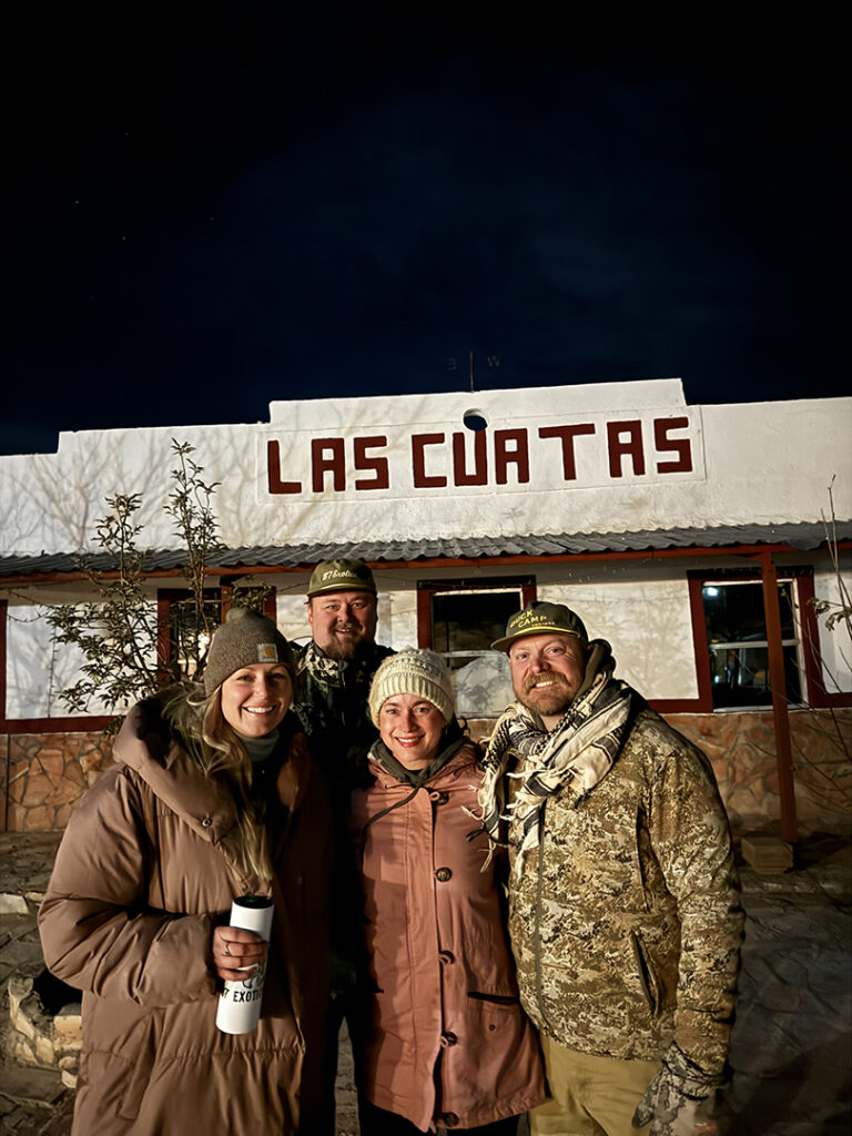 Group of Hunters Standing Outside Las Cuatas Ranch Building During a Hunting Trip in Texas.