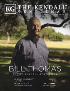 The August 2026 cover of The Kendall Gentleman featuring Bill Thomas, founder of Joy Pipe USA, standing beneath a live oak in the Texas Hill Country.