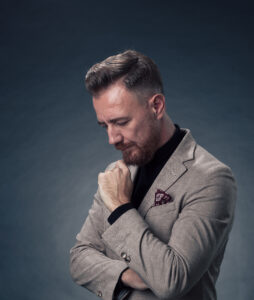 Man in a tailored suit reflecting personal style, BetterMENt column