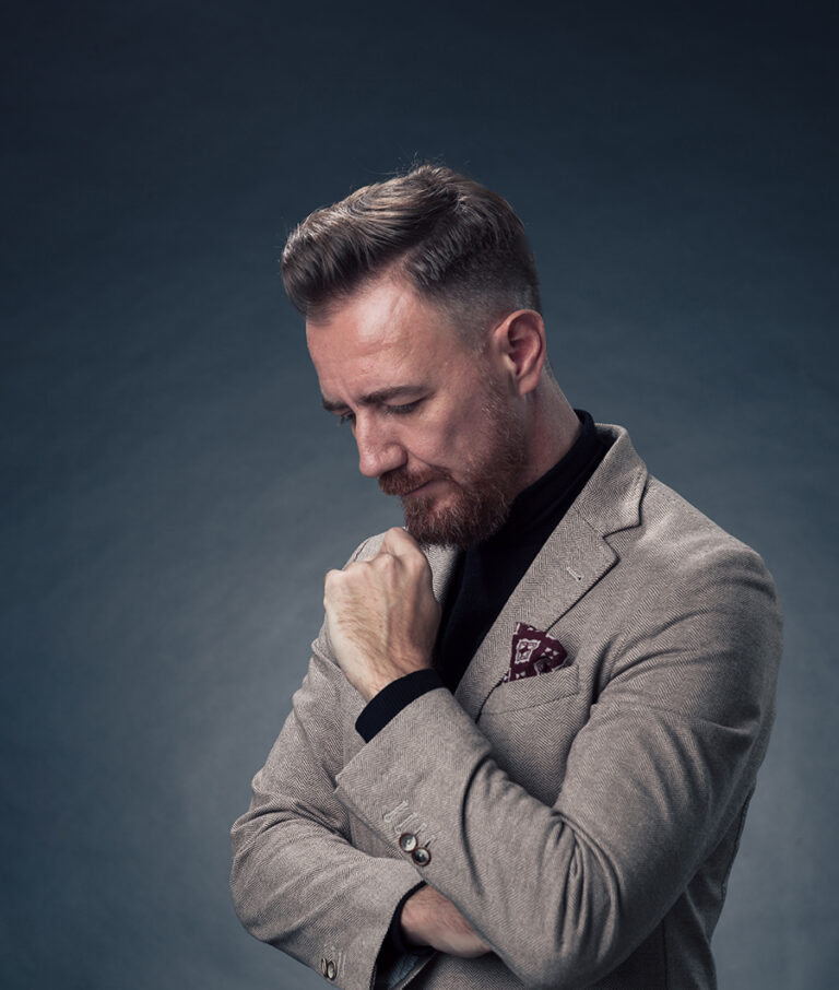 Man in a Tailored Suit Reflecting Personal Style, Betterment Column
