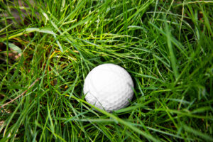 Golf ball on green grass, symbolizing a Mulligan or second chance