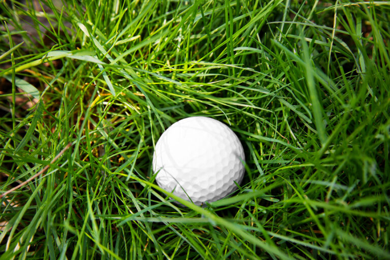 Golf Ball on Green Grass, Symbolizing a Mulligan or Second Chance