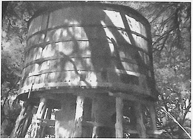 Vintage Photo of the Old Cypress Town Water Tank on Stilts in Boerne, Texas
