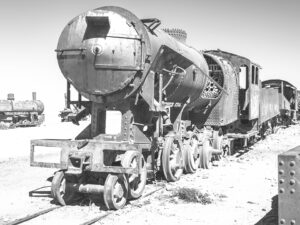 Old Rusty Steam Locomotive in a Train Graveyard, Black and White Photo