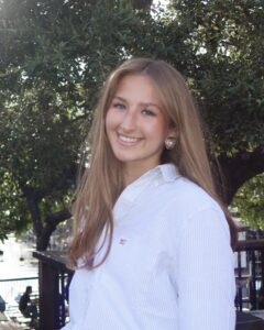 Addison Schuepbach in a White Button-down Shirt Outdoors