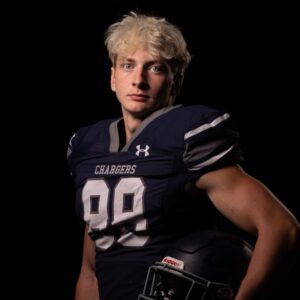 Brayden Church in a Navy Chargers Number 99 Football Jersey