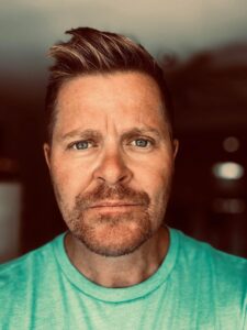 Brian Mcvey in a Teal T-shirt