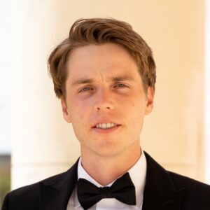 Louis Barnes in a Black Tuxedo and Bow Tie